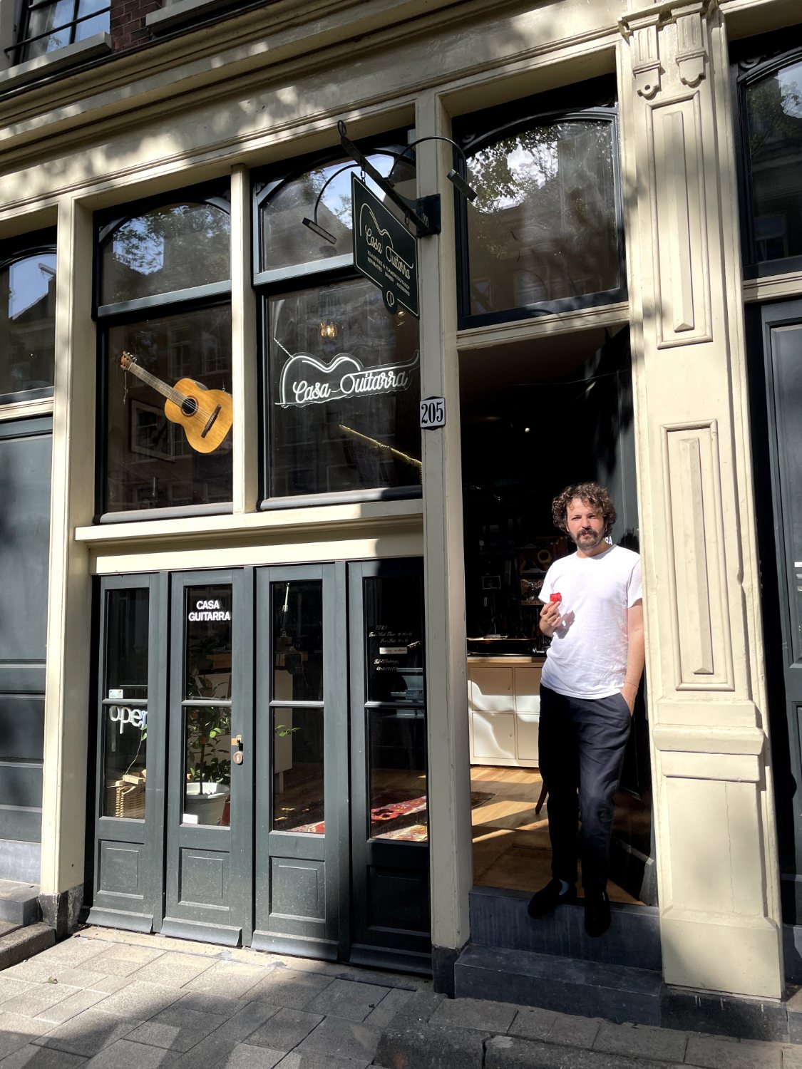 Ahmad at the door of Casa Guitarra on Czaar Peterstraat in Amsterdam
